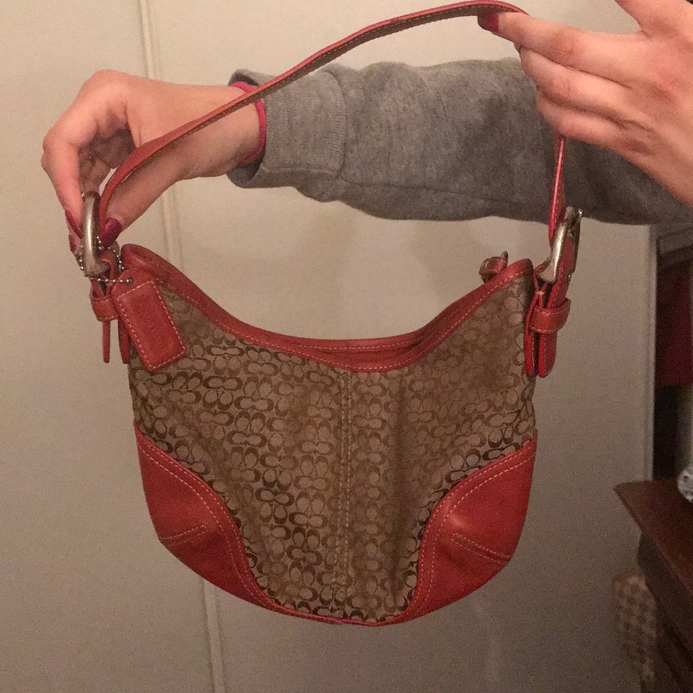 Red leather and beige coach purse